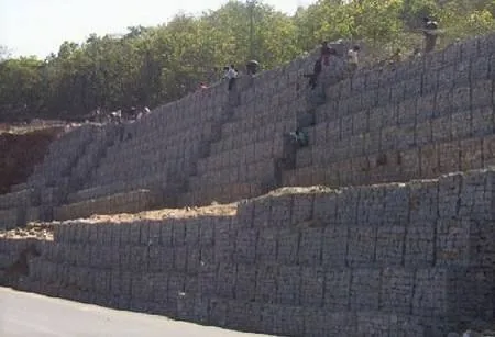 Stepped gabion structure protecting a slope